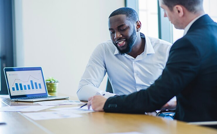 two men in a meeting